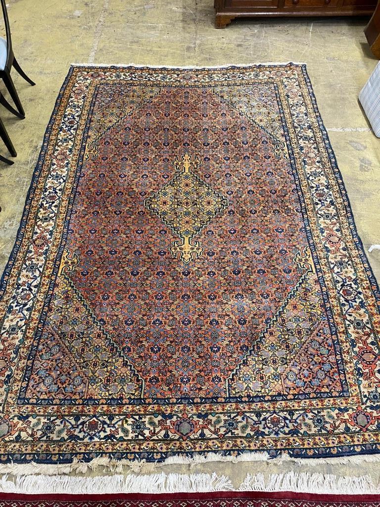 A North West Persian style peach ground carpet, 300 x 206cm